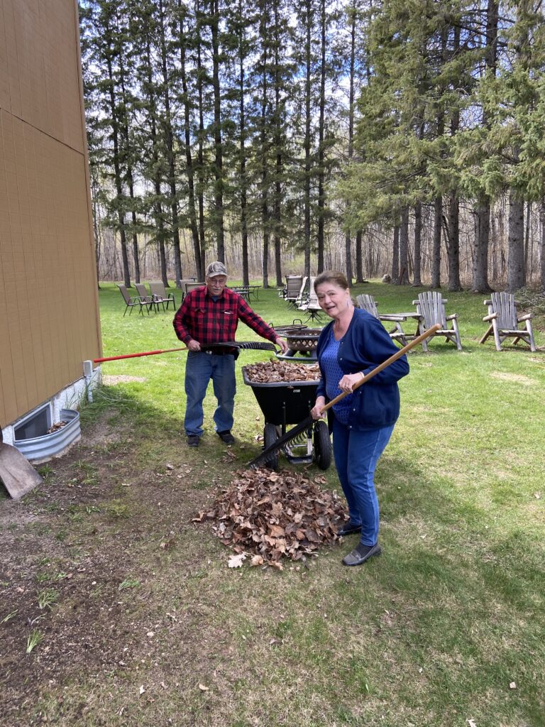 My Mom and Dad hard at work, helping get the yard ready for their anniversary party coming up