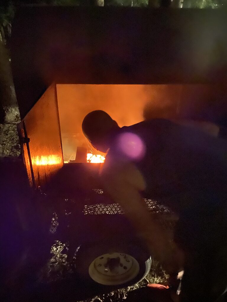 Josh fireing up the smoker